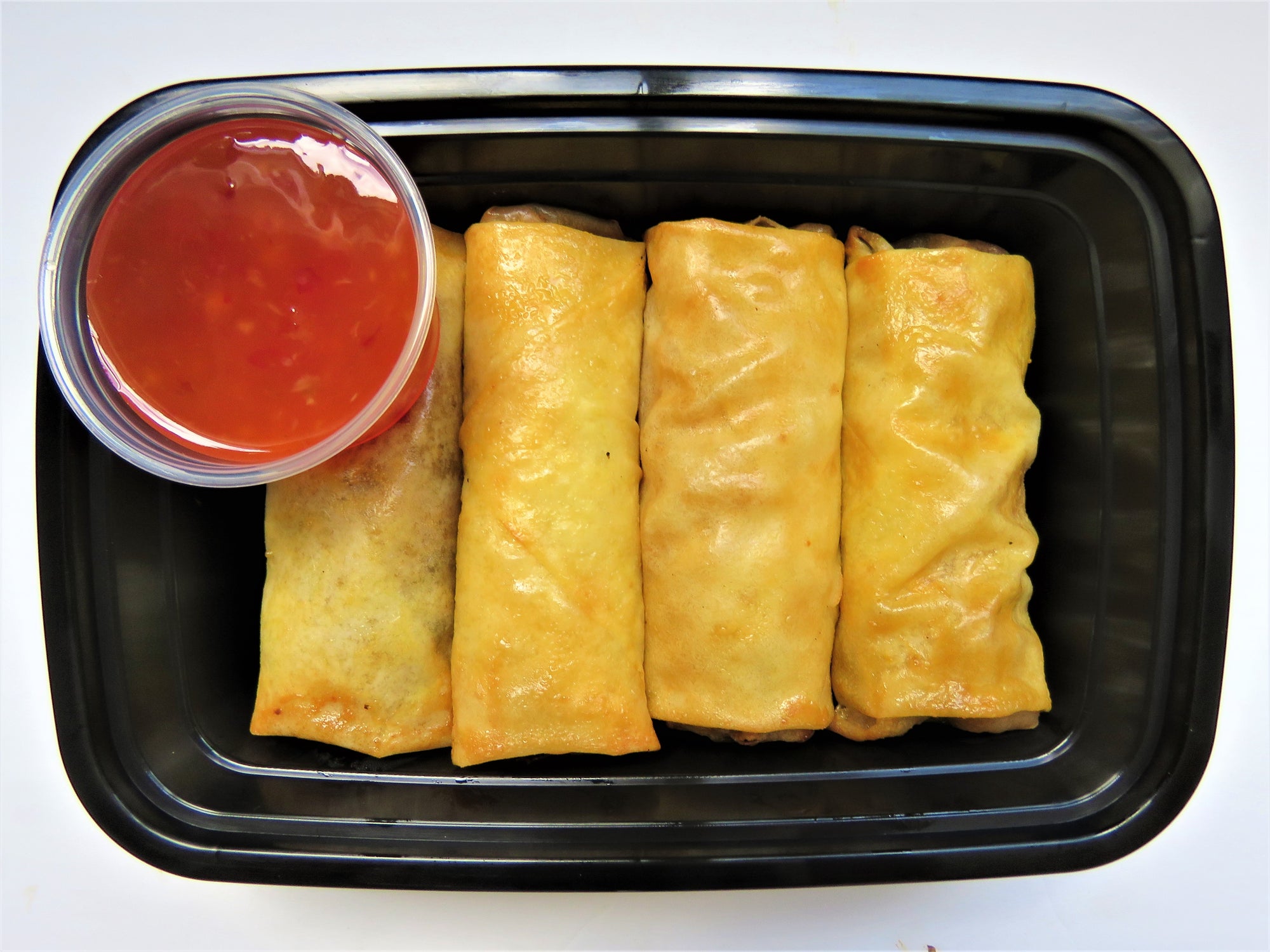 Guilt-free spring rolls with ground beef, cabbage, carrot, and onion filling and served with sweet and spicy sauce! 